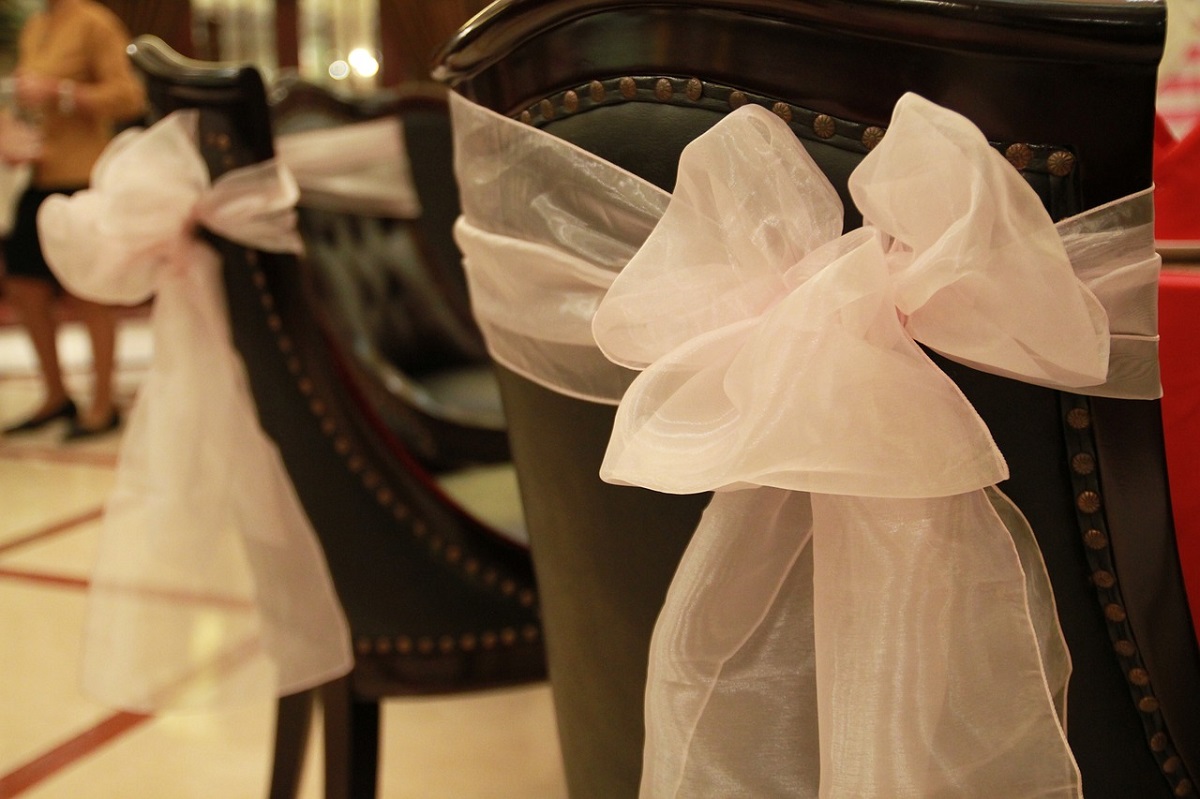 Chairs with white lace ribbons - wedding decor