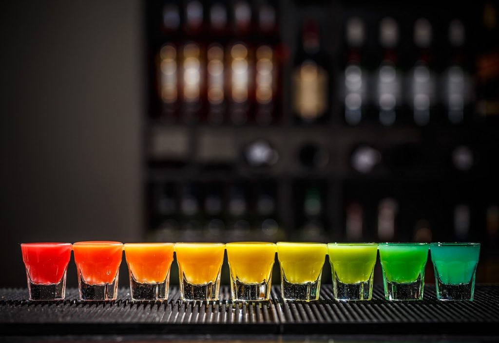 shots with rainbow colors on a bar counter