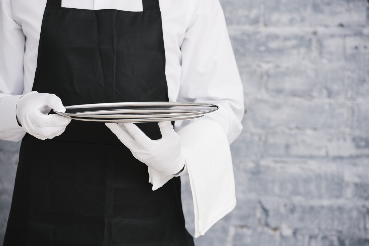 Close up of a waiter in uniform