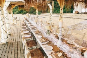 A long wedding table at the beach