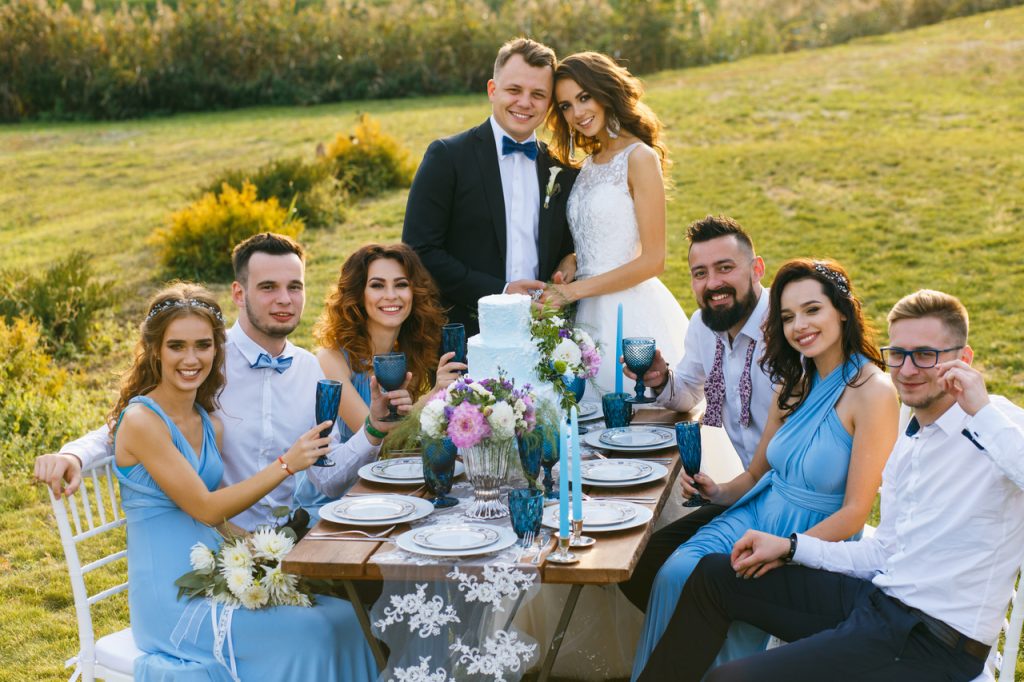 Newlyweds with their guests at an intimate wedding