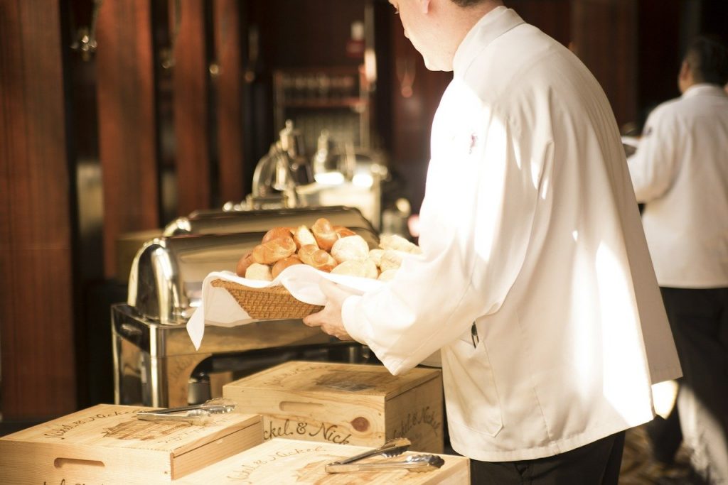 A Juan Carlo Caterer preparing the buffet table